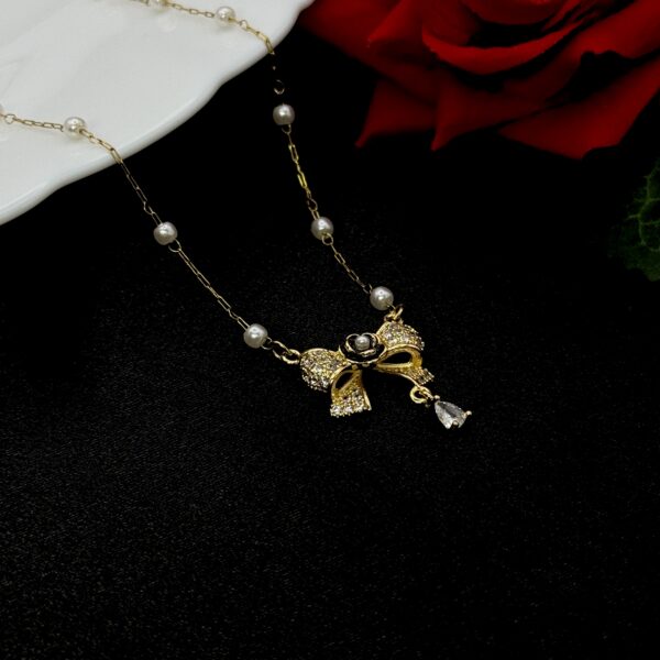 Stainless Steel Bow Shaped Pendent Pearl Chain Necklace, Product Code: D-5158